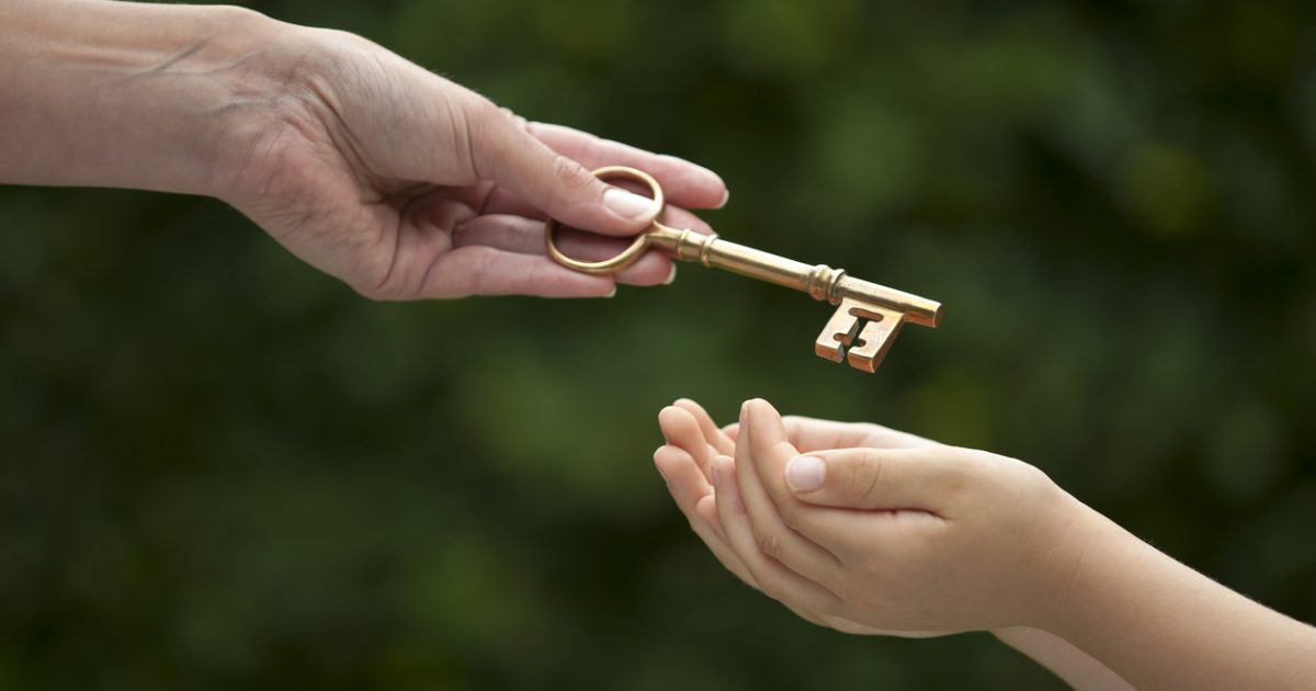 adult hands key to child